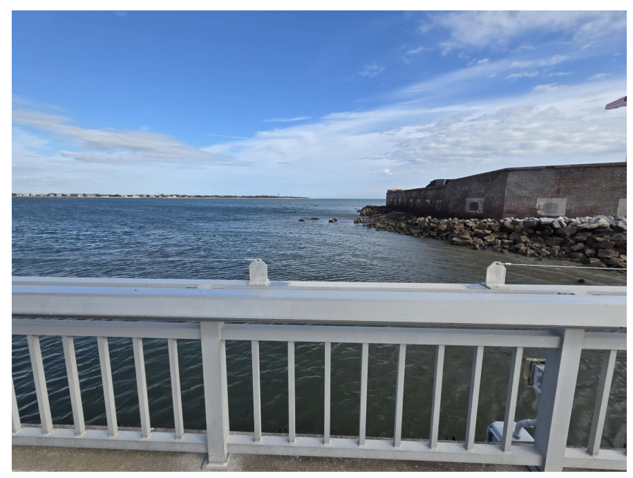 After: Empty railing at Fort Sumter pier where the Climate Change sign was removed