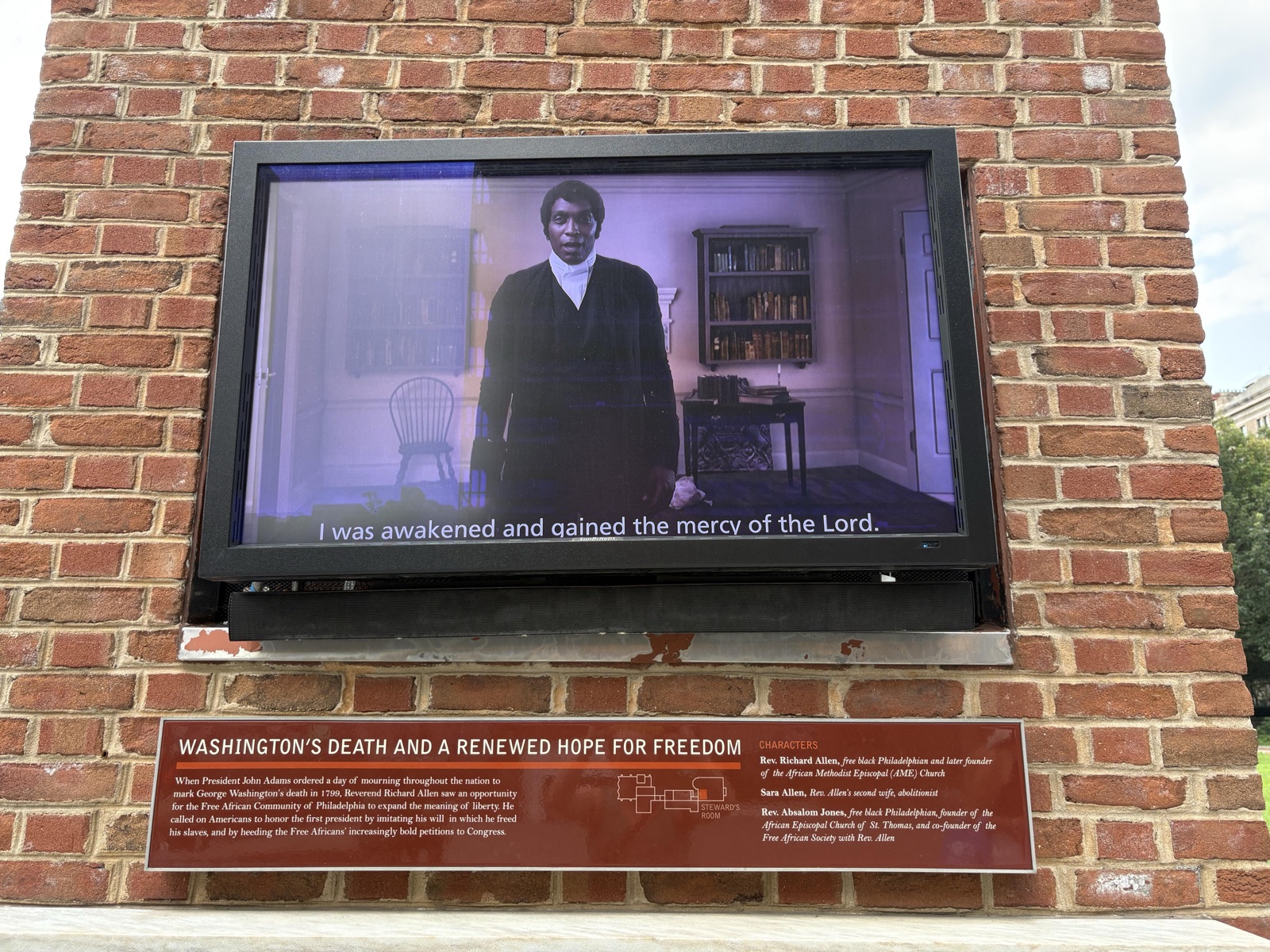 "Washington's Death and a Renewed Hope for Freedom" (plaque next to a TV monitor) — before